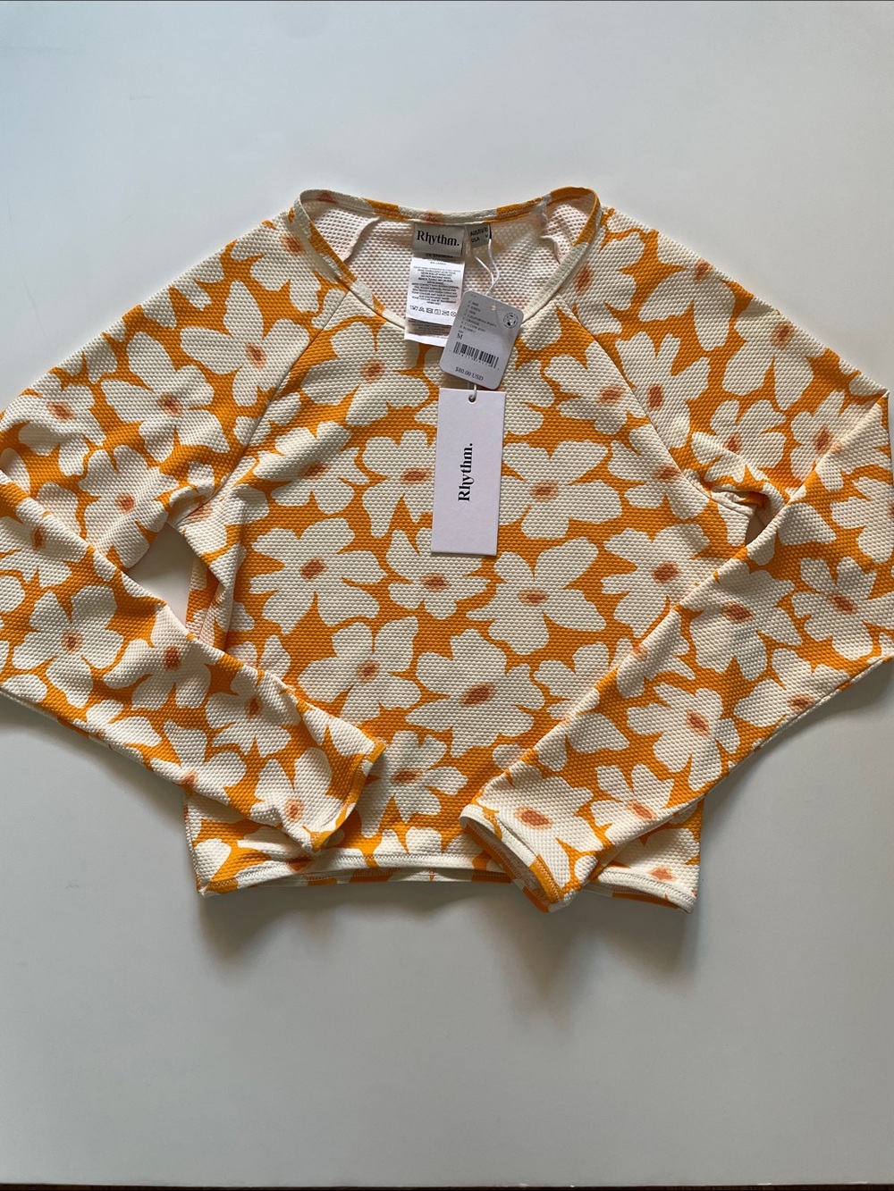 FP Movement. Rhythm. California Poppy. Orange. Floral. Long Sleeve Surf Crop